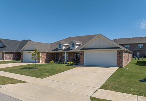 A house with a garage and a driveway.